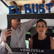 To fight state media censorship in Venezuela, journalists are using cardboard television screens to present news reports on city buses. (Kejal Vyas/Wall Street Journal)